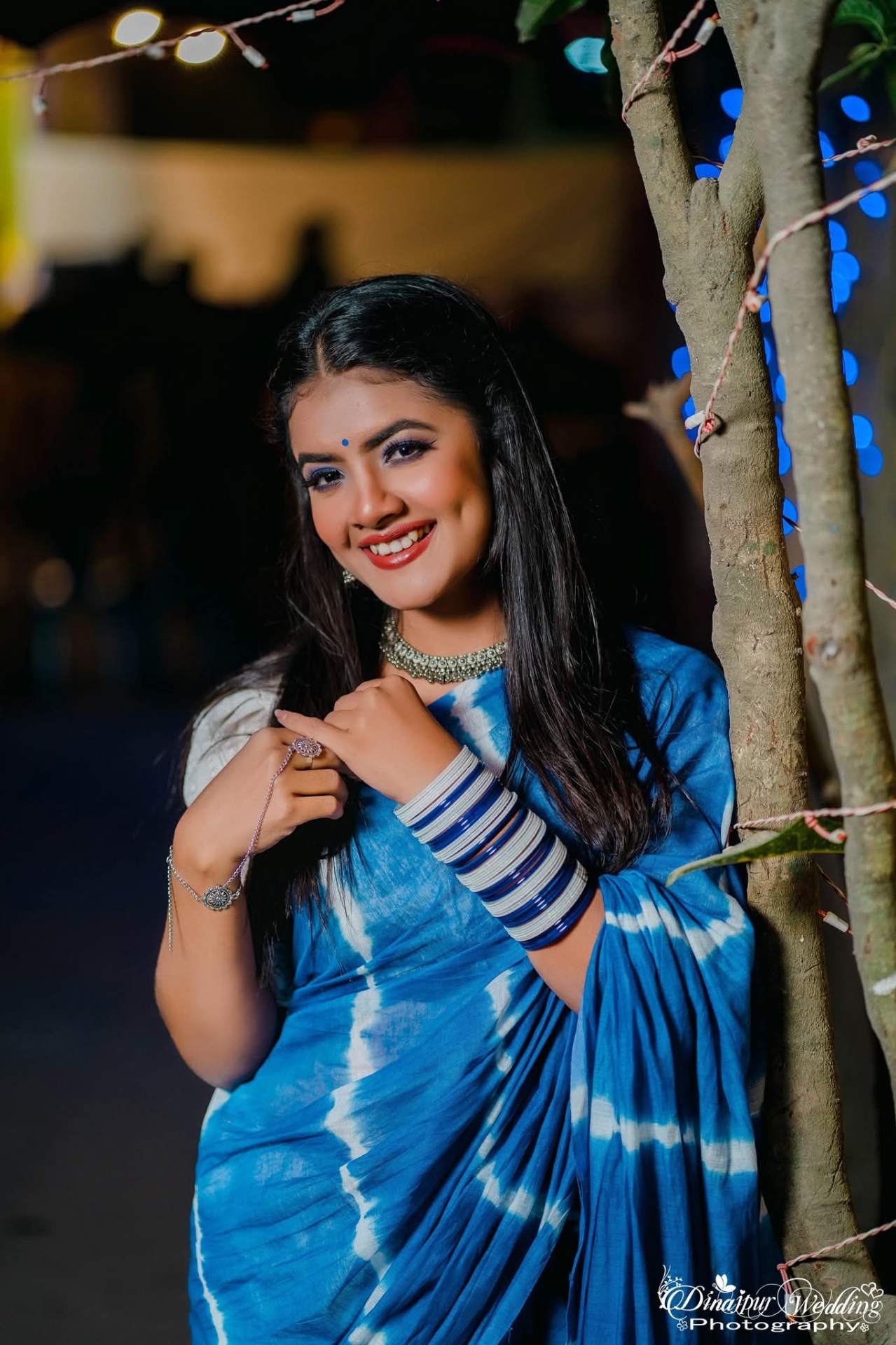 Prety Chowdhury — blue tie-dye saree signature wedding portrait