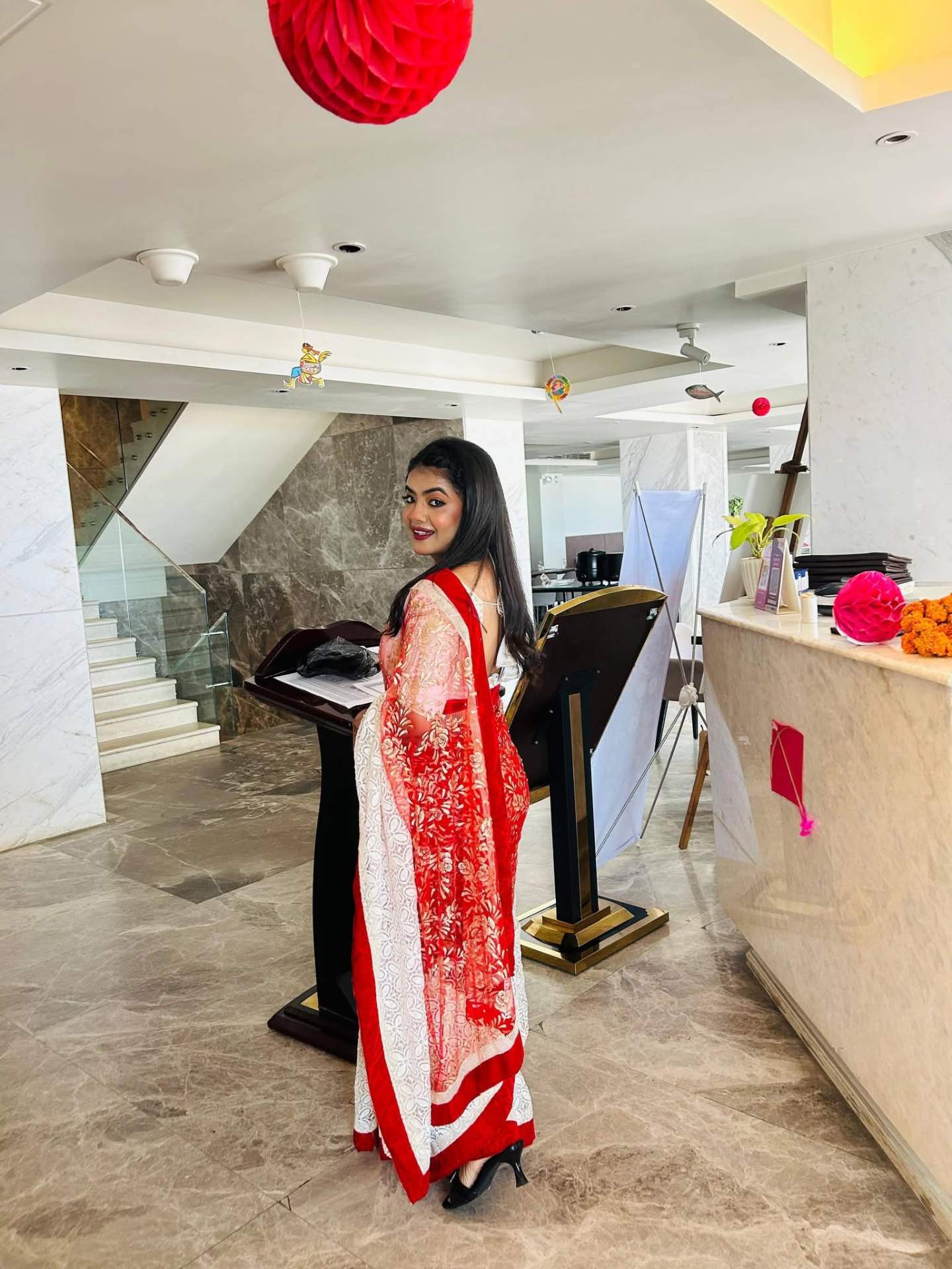 Prety Chowdhury — Ramada Cox's Bazar reception podium red saree elegant pose