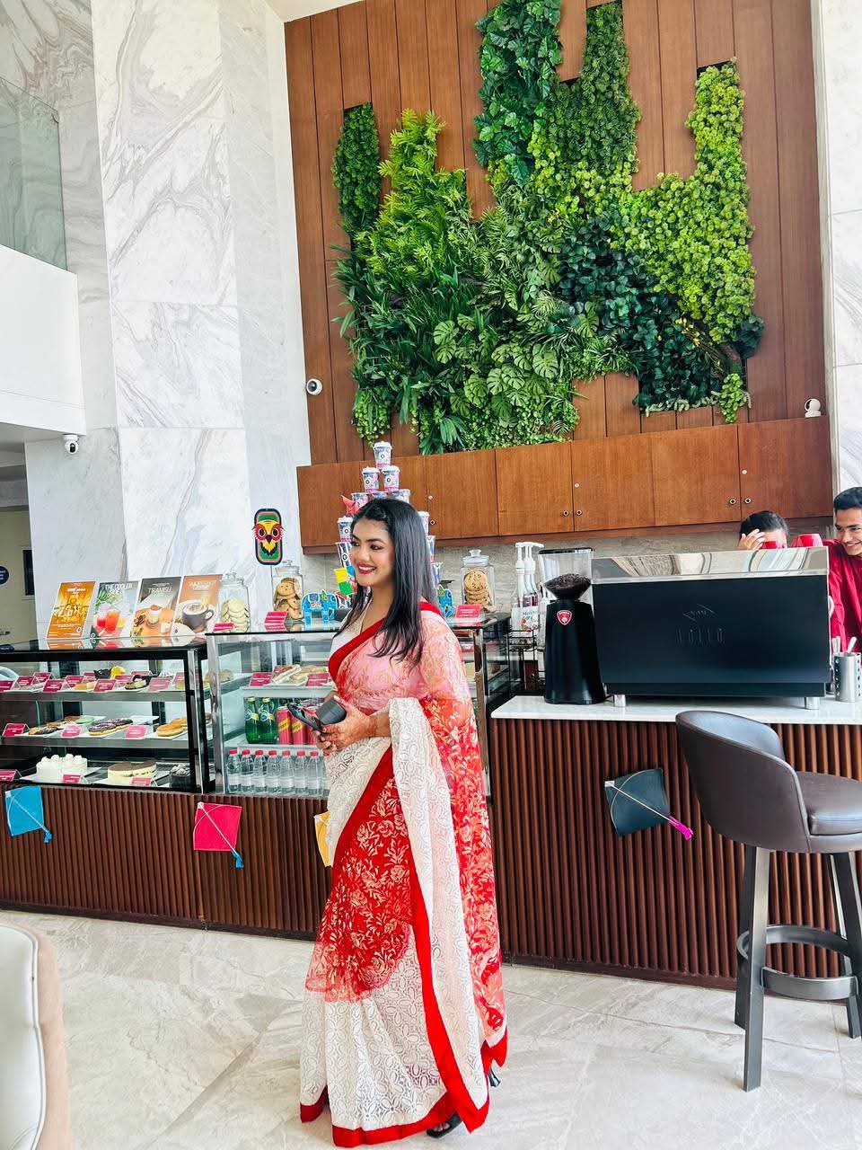 Prety Chowdhury — Ramada Cox's Bazar lobby café red saree full-length