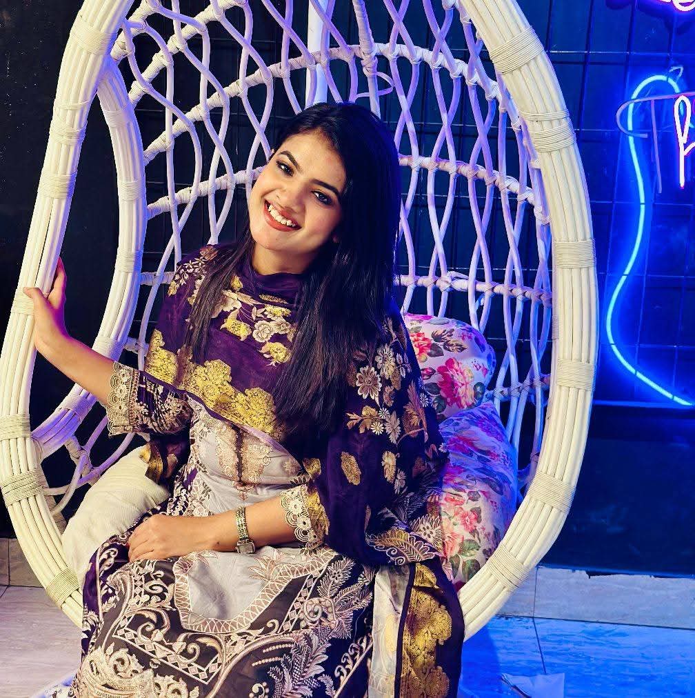 Prety Chowdhury — neon swing chair pose