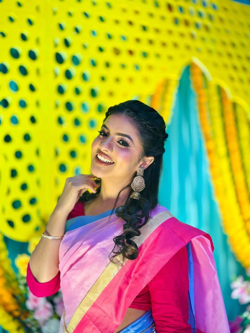 Prety Chowdhury — vibrant pink saree at haldi backdrop