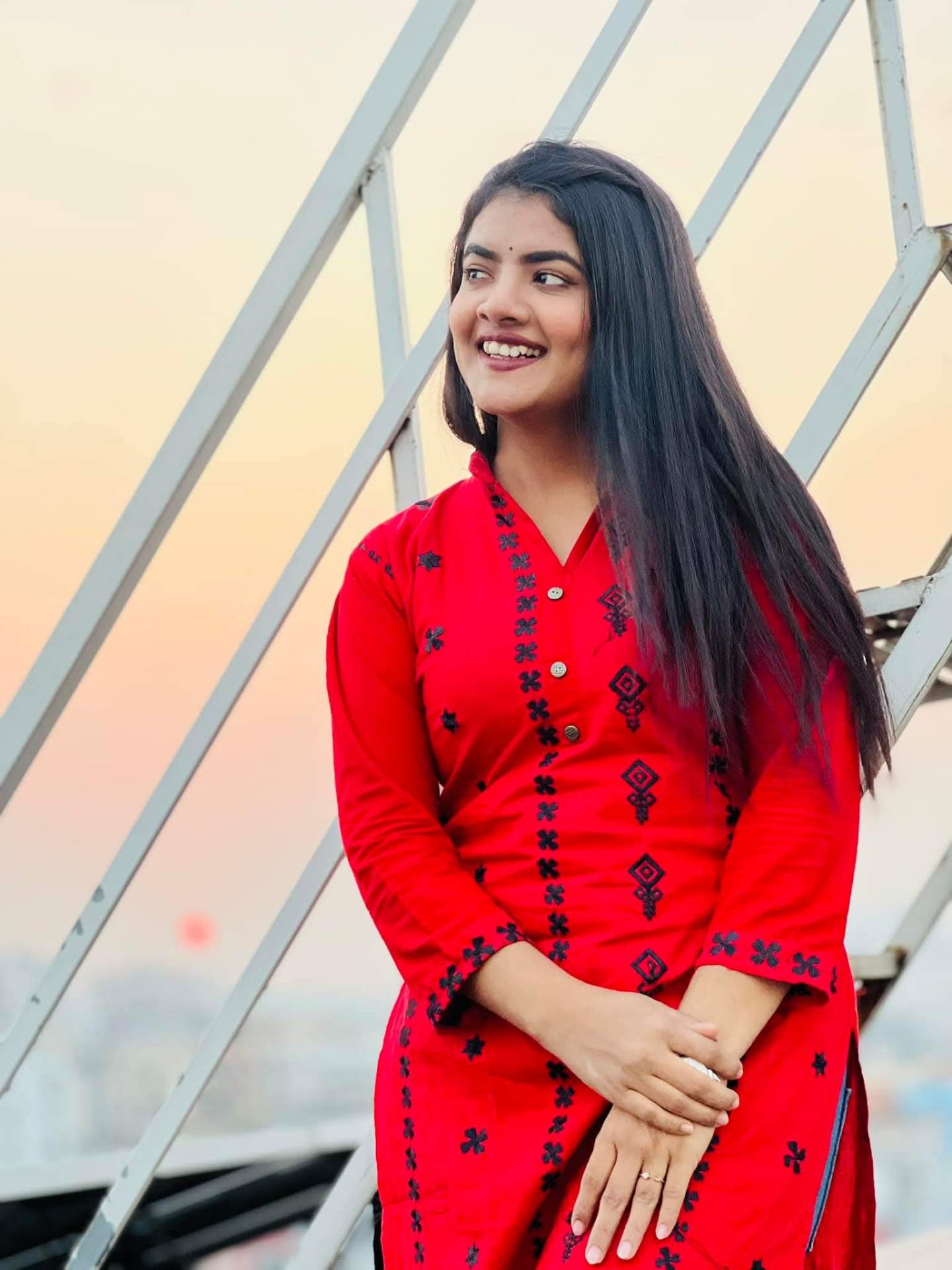 Prety Chowdhury — red kurti rooftop sunset